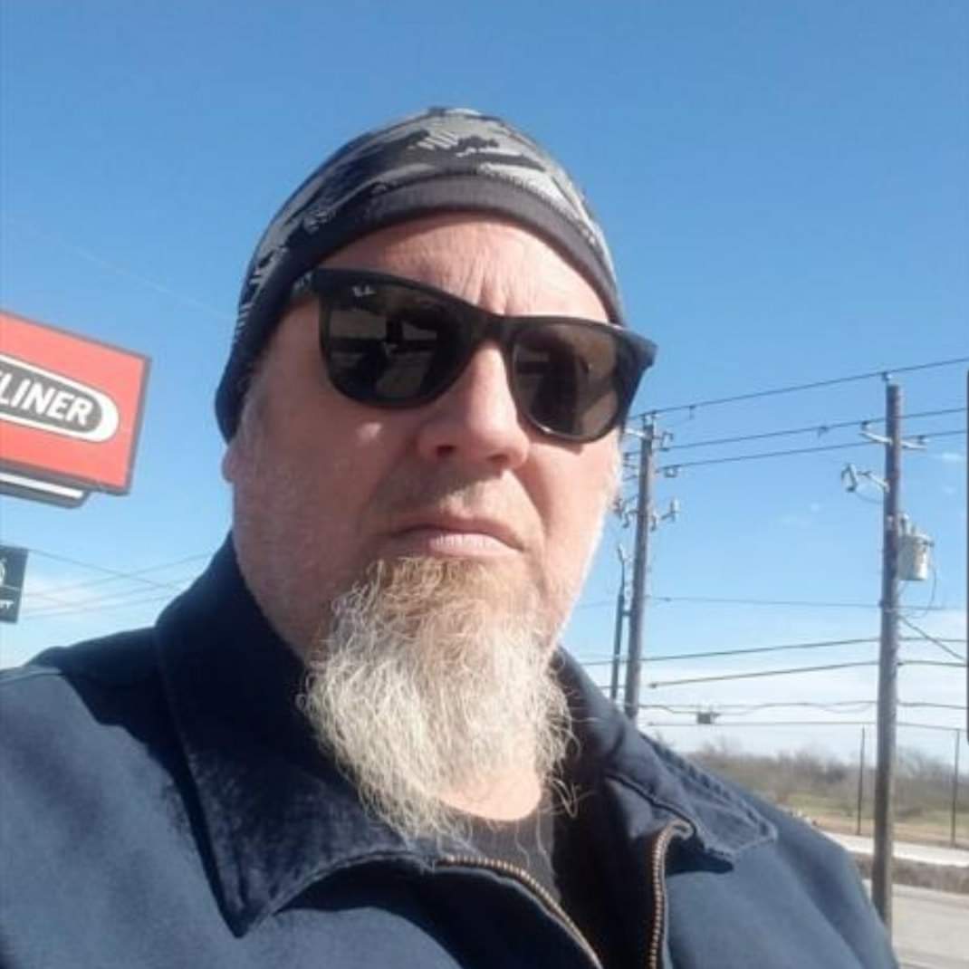 Clayton Loban wearing sunglasses outdoors.