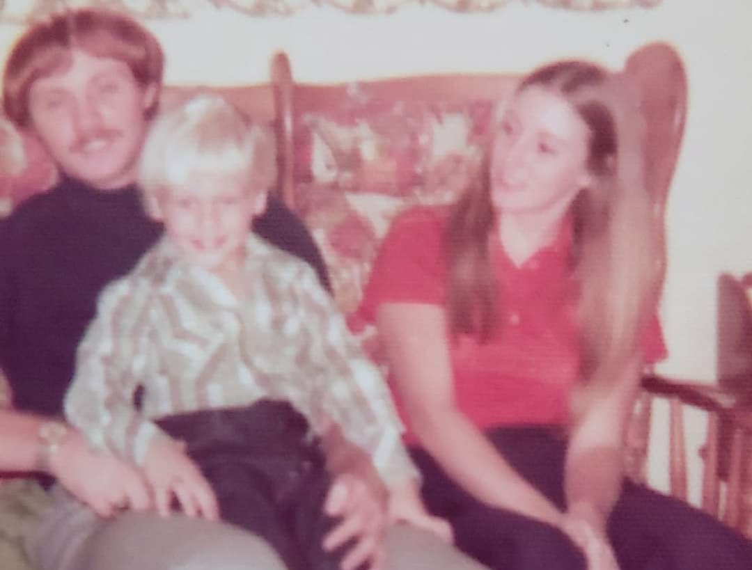 Childhood photo of Clayton Loban with family members.