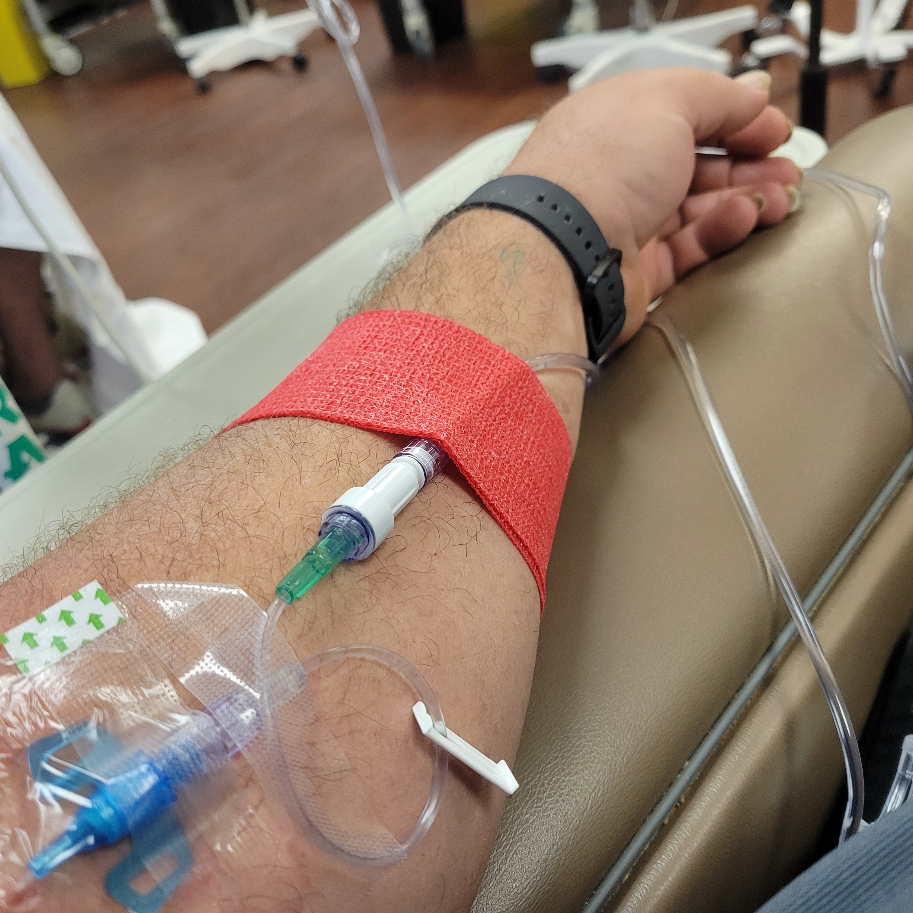 Clayton Loban during cancer treatment with IV line visible.